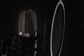 Black studio microphone on black background, close up Royalty Free Stock Photo