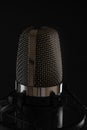Black studio microphone on black background, close up Royalty Free Stock Photo