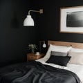 Black stylish loft bedroom Unmade bed with breakfast and reading on tray Lamp and interior decor over blank blackboard wall