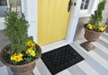 Black Stylish Zig-Zag patterned with motif border welcome entry door mat with yellow flowers and leaves Royalty Free Stock Photo