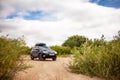 Black Subaru Forester at sandy river coast