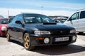 Black Subaru Impreza first generation parked on the street