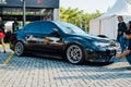 Black Subaru WRX STI sedan in car modification show Royalty Free Stock Photo