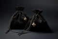 Black suede fabric bags with laces, decorated with stones and amulets for jewelry