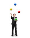 Black suit businessman juggling colorful balls Royalty Free Stock Photo