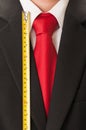 Black suit, red tie, white shirt and centimeter Royalty Free Stock Photo