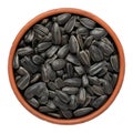 Black sunflower seeds in a bowl isolated on white background. Top view Royalty Free Stock Photo