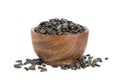 Black sunflower seeds in bowl isolated on white background Royalty Free Stock Photo