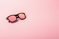 Black sunglasses with Multicolor Mirror Lens on pink background. Polarized sunglasses with UV protection. Royalty Free Stock Photo