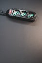 Black surge protector on a black background