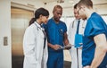 Black surgeon giving instruction to medical team