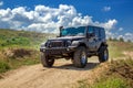 Black SUV car with a winch and big wheels for off-road driving travels. Royalty Free Stock Photo