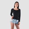 Black sweatshirt template on a girl in shorts, front view, fashionable clothes with long sleeves, for design presentation