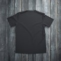 Black t-shirt on wooden background