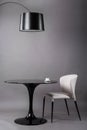 Black table, chair and the floor lamp on gray background. Modern furniture composition for interior. Royalty Free Stock Photo