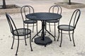 Black table and chair set in public park Royalty Free Stock Photo