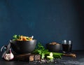 Black table with kvass and ingredients, delicious okra soup with plain navy blue Royalty Free Stock Photo