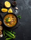 Black table with kvass and ingredients, delicious okra soup with plain navy blue Royalty Free Stock Photo