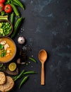 Black table with kvass and ingredients, delicious okra soup with plain navy blue Royalty Free Stock Photo