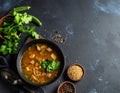 Black table with kvass and ingredients, delicious okra soup with plain navy blue Royalty Free Stock Photo