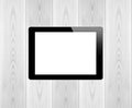 Black tablet pc same with ipade on wood background Royalty Free Stock Photo