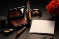 On a black tabletop, a white paper, lipstick, and miscellaneous items Royalty Free Stock Photo