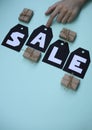 On black tags there is an inscription in white letters, the word is for sale