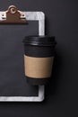 Black take away coffee cup and clipboard blank menu Royalty Free Stock Photo