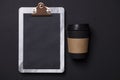 Black take away coffee cup and clipboard blank menu Royalty Free Stock Photo