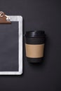 Black take away coffee cup and clipboard blank menu Royalty Free Stock Photo