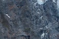 Black tall cliff with ice and waterfall begining of the glacier in Mt Cook National Park. I Royalty Free Stock Photo