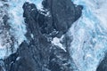 Black tall cliff with ice and waterfall begining of the glacier in Mt Cook National Park. I Royalty Free Stock Photo