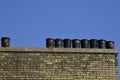 Black tar pails setting on roof ledge