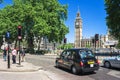 Black taxi cab in front of Big Ben. London, UK Royalty Free Stock Photo