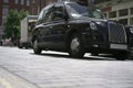 Black taxi on London street