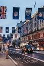 Black taxi and red bus on Regent Street, London, UK Royalty Free Stock Photo