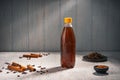 Black tea with cinnamon oil in a misted bottle near the cinnamon Royalty Free Stock Photo