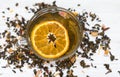 Black tea. Cup of tea with dried orange. Herbal tea with dried citrus. Black tea cup on white background