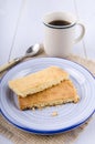 Black tea in a cup and a plate with scottish shortbread Royalty Free Stock Photo