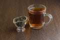 Black tea cup and sugar bowl on the wooden table Royalty Free Stock Photo