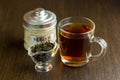 Black tea cup and sugar bowl on the wooden table Royalty Free Stock Photo