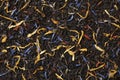 Black tea with dried flower leaves full frame as background Royalty Free Stock Photo