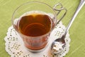 Black tea in a glass cup with sweetener Royalty Free Stock Photo