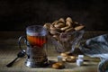 Black tea in glass with cupholder and drying