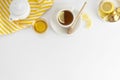 Black tea with lemon and honey on a white background. Hot tea cup isolated, top view flat lay. Flat lay. Autumn, fall or winter Royalty Free Stock Photo