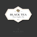 Black tea logo. Label for elite tea. The leaves and letters in a classic style on a white geometric label.