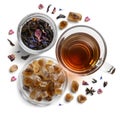 Black tea with natural flavors and a cup. Top view on white background Royalty Free Stock Photo