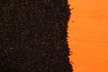 Black tea on an orange background Royalty Free Stock Photo