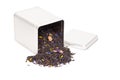 Black tea spilling out of a tea box Royalty Free Stock Photo