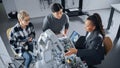 Black Teacher with Laptop and Two Diverse Students Analyse and Discuss Futuristic Robotic Arm During Royalty Free Stock Photo